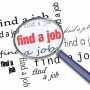 A magnifying glass hovering over the words Find a Job